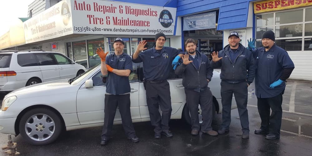 Photo of Mechanics Outside The Shop